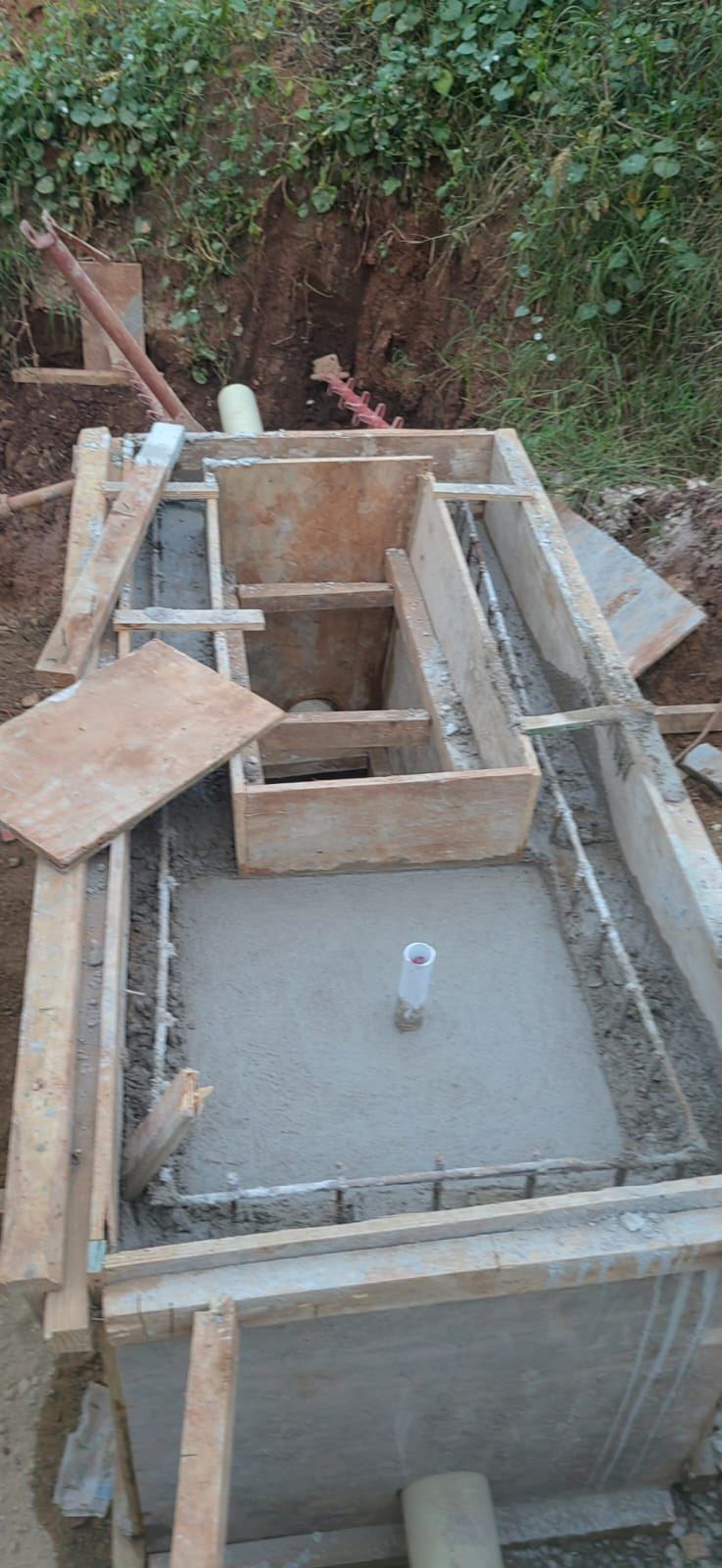 Concrete chamber cast inside timber formwork