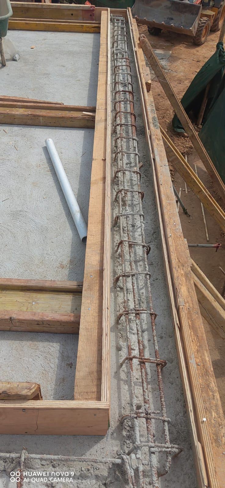 Reinforcement and formwork for a concrete beam